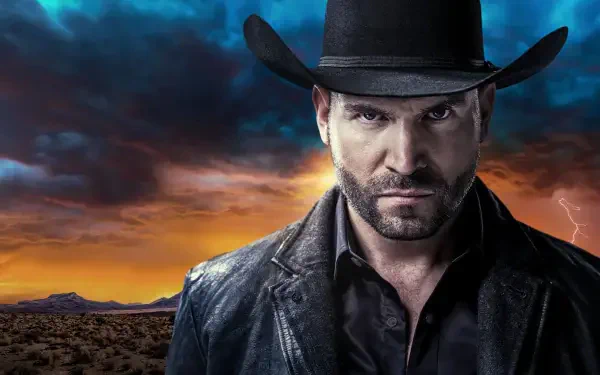 Brooding man in a black coat and cowboy hat against a stormy sunset desert horizon — El Señor de los Cielos HD PC desktop wallpaper and background.