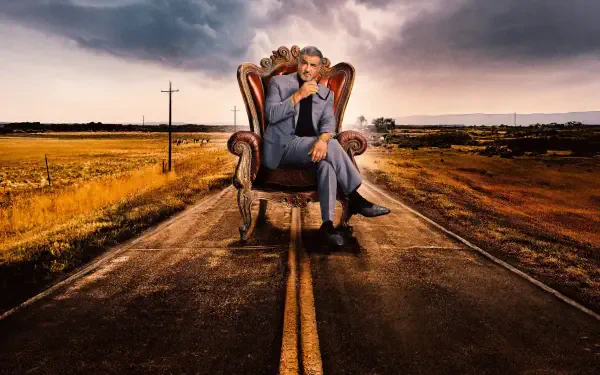 Tulsa King 4K Ultra HD PC desktop wallpaper: a suited man seated in an ornate armchair on a deserted two-lane road, stormy sky and open plains stretching to the horizon.