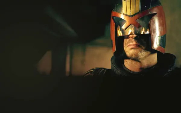 Dredd helmet close-up in low light, visor glinting and jaw set — gritty 4K Ultra HD PC desktop wallpaper and background.