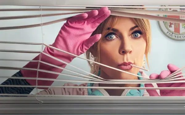 HD PC desktop wallpaper from the TV show High Potential: a surprised woman in pink rubber gloves peeks through blinds, close-up on her wide, expressive eyes.