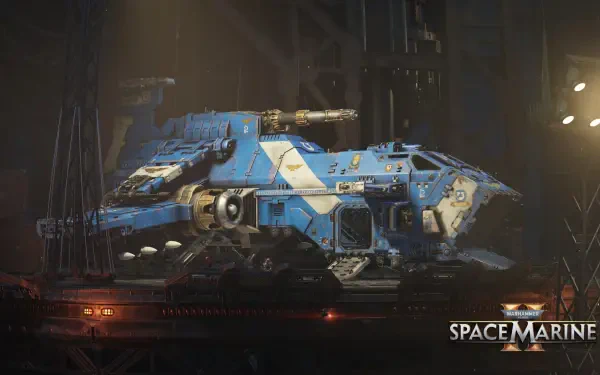 4K Ultra HD PC desktop wallpaper from the video game Warhammer Space Marine: a blue Space Marine armored transport in a dim industrial hangar, emblazoned with chapter insignia.