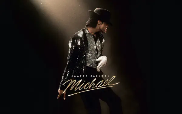 8K Ultra HD PC desktop wallpaper titled Michael (2026) — silhouetted sequined performer in a fedora and single white glove striking a pose beneath a dramatic spotlight.