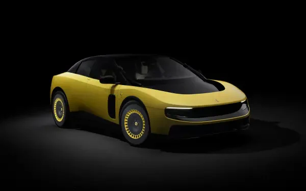 Yellow Ferrari Luce sports vehicle on a black studio backdrop, presented as a 4K Ultra HD PC desktop wallpaper.