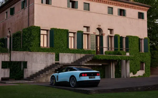 Light blue Ferrari Luce parked by an ivy-covered villa, 4K Ultra HD PC desktop wallpaper and background.