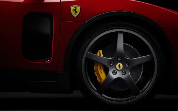Close-up of a red Ferrari Luce vehicle wheel and yellow brake caliper with prancing horse emblem against a dark backdrop — 4K Ultra HD PC desktop wallpaper.