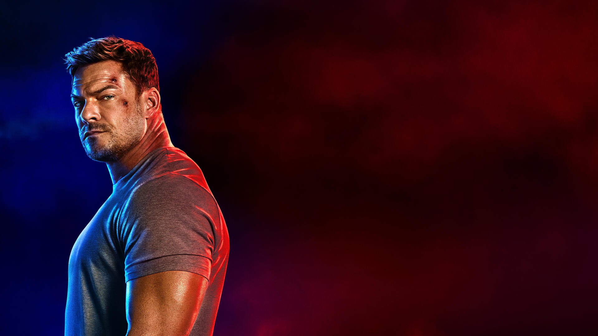 Reacher in dramatic red-blue lighting, muscular profile at left against dark gradient — 4K Ultra HD PC Desktop Wallpaper and Background.