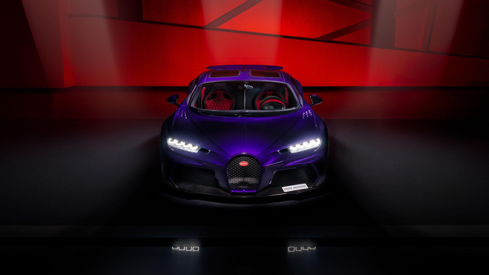 Front view of a purple Bugatti Chiron Super Sport car on a glossy floor with red geometric backdrop — 4K Ultra HD PC desktop wallpaper and background.