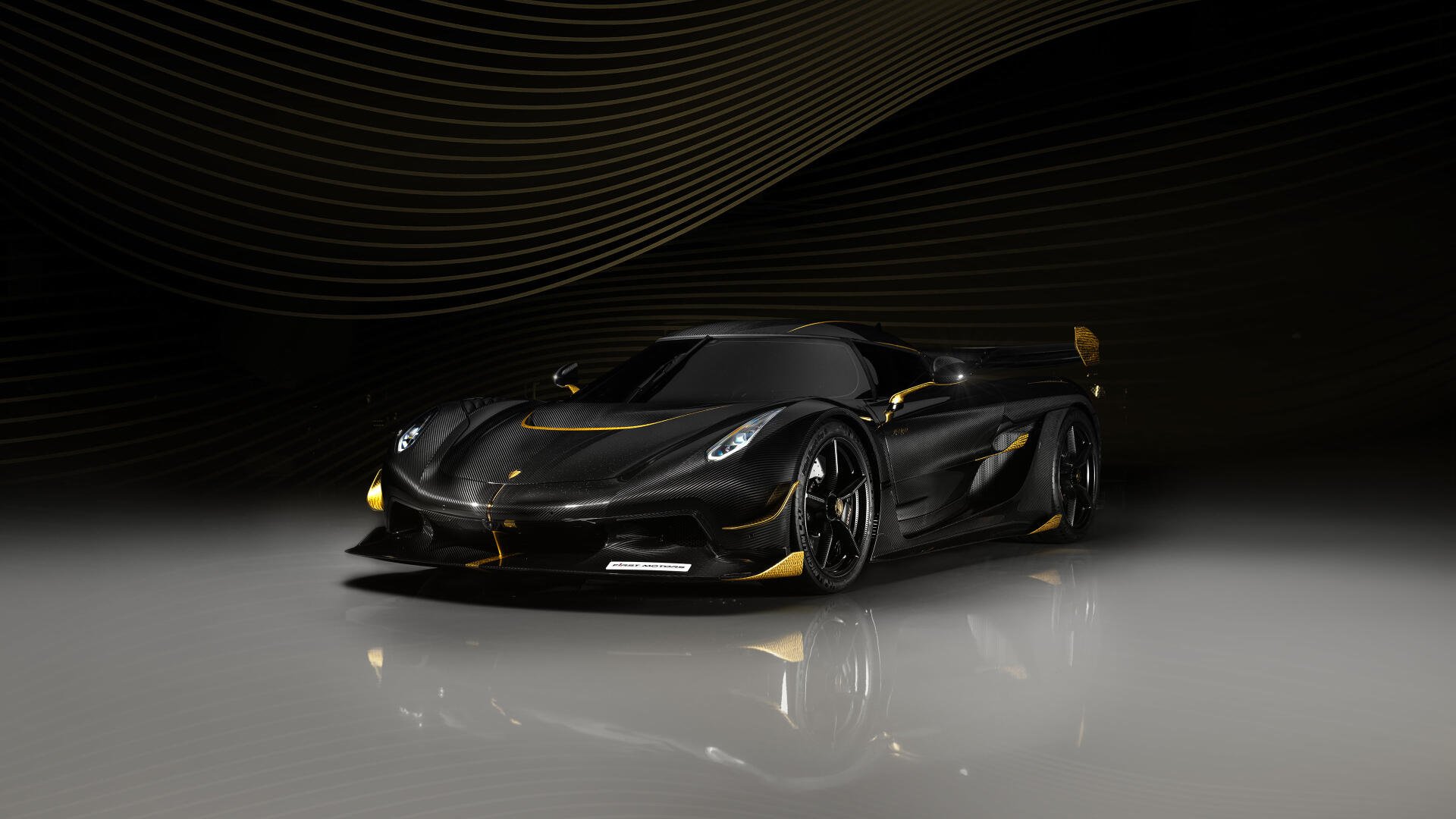 Koenigsegg Jesko hypercar in glossy black with gold accents, dramatic studio lighting on a reflective floor — 4K Ultra HD PC desktop wallpaper/background.