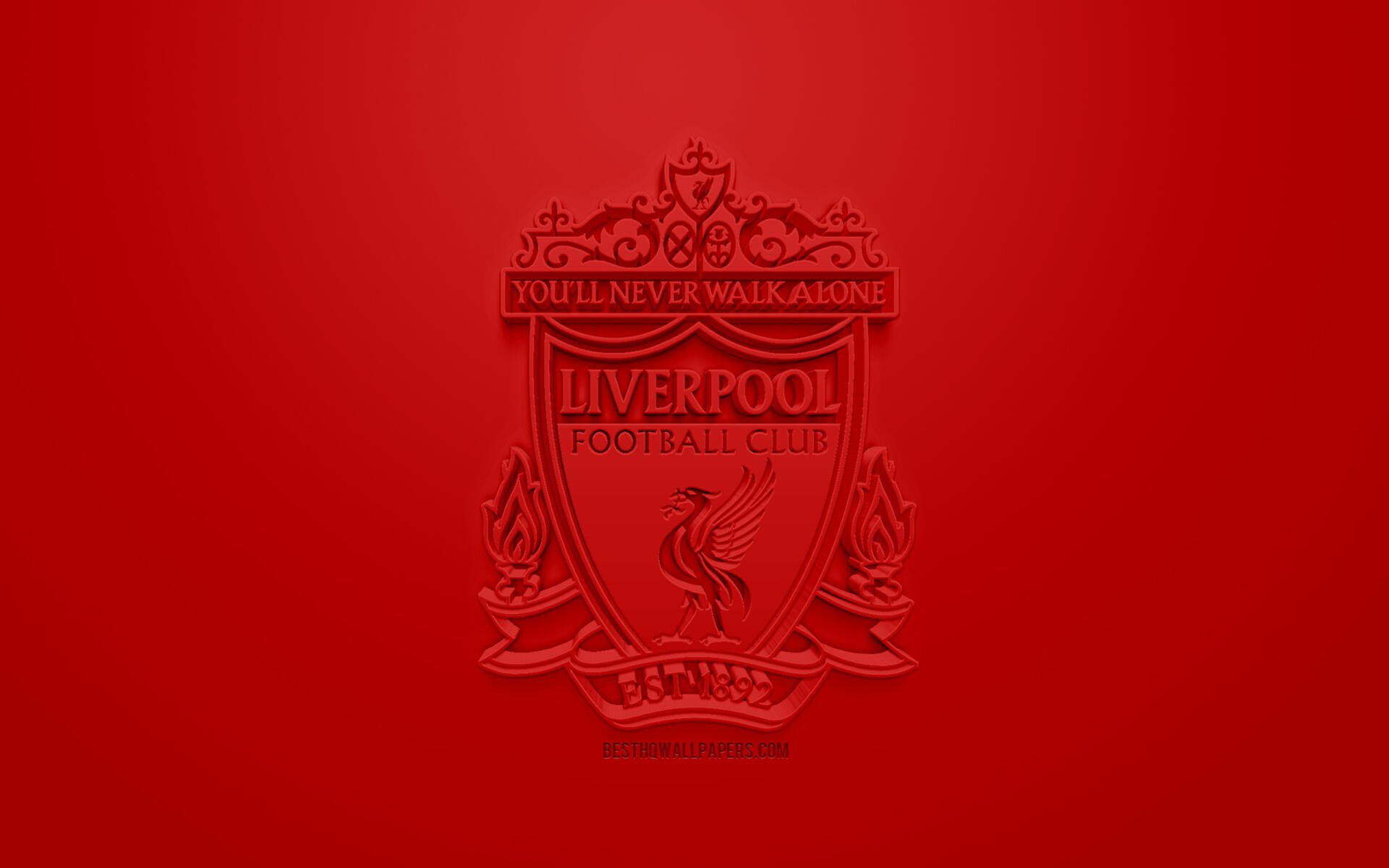 Liverpool F.C. logo embossed in deep red at center of a solid red 2K Quad HD PC desktop wallpaper.