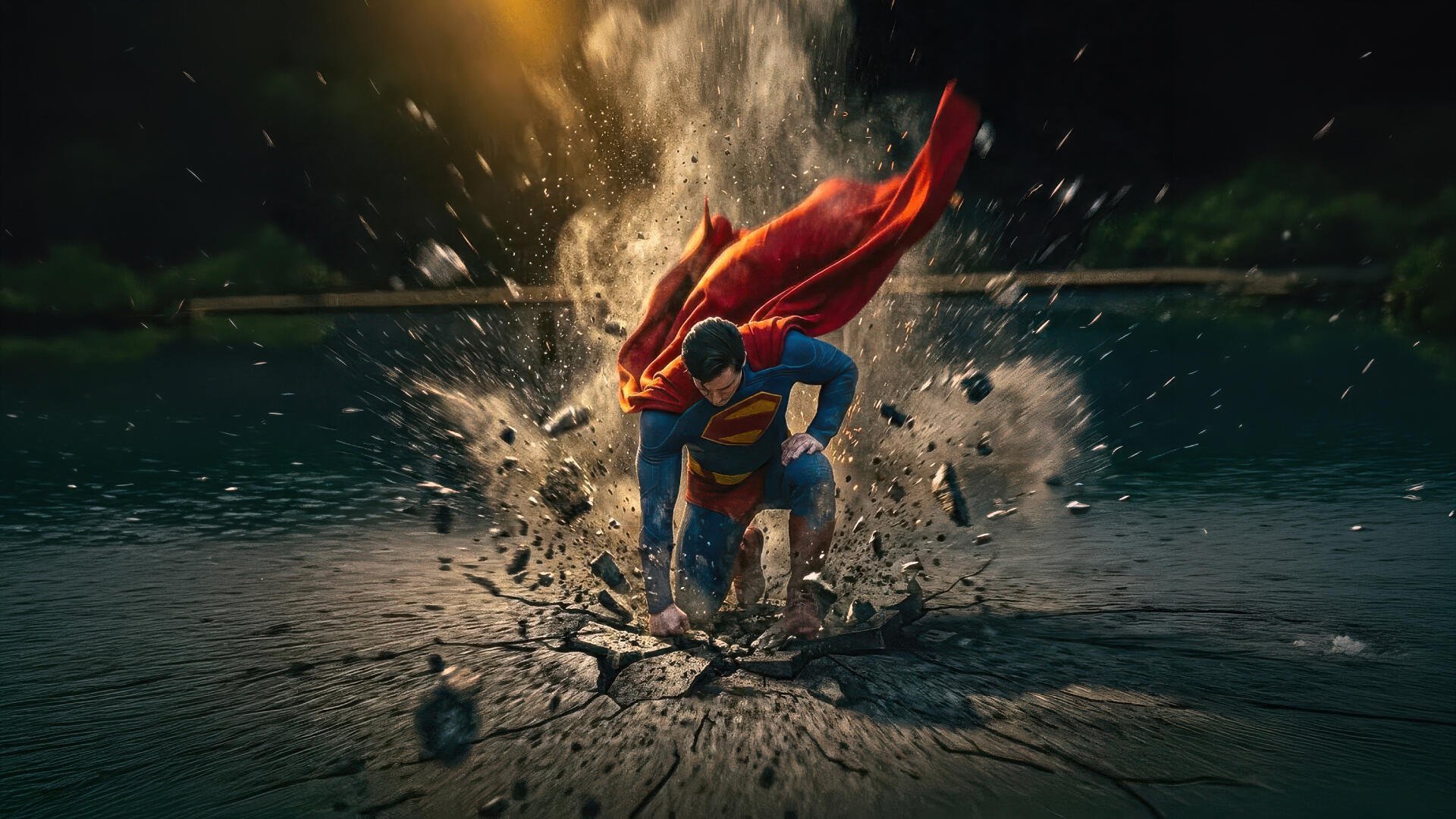 Superman bursts up through shattered ground and water, cape billowing amid flying debris — vivid, high-detail 5K Ultra HD PC desktop wallpaper and background.
