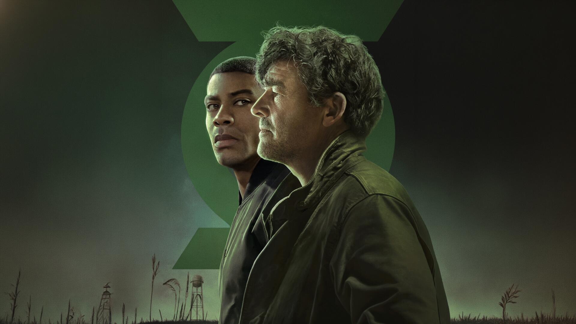 Lanterns (2026) 4K Ultra HD PC desktop wallpaper: two men in profile beneath a glowing green emblem, misty field foreground and moody cinematic lighting.