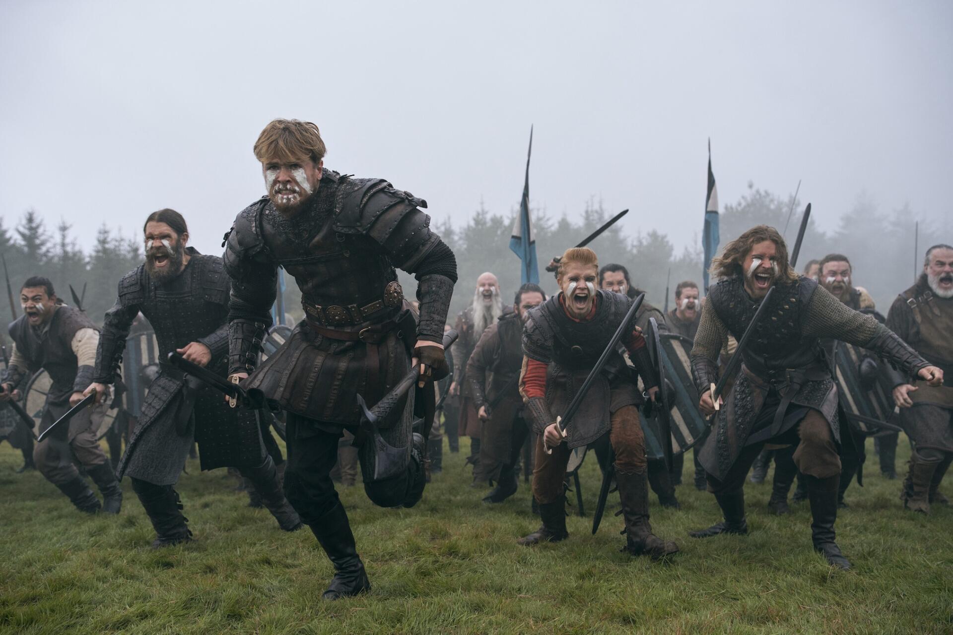 Bloodaxe warriors charge across a misty medieval battlefield in dark armor, HD PC desktop wallpaper and background.