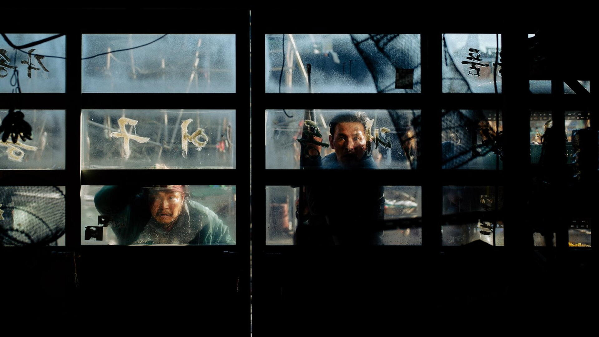 Hope (2026) cinematic scene of a man behind rain-streaked glass panels, featured as a 2K Quad HD PC desktop wallpaper and background.