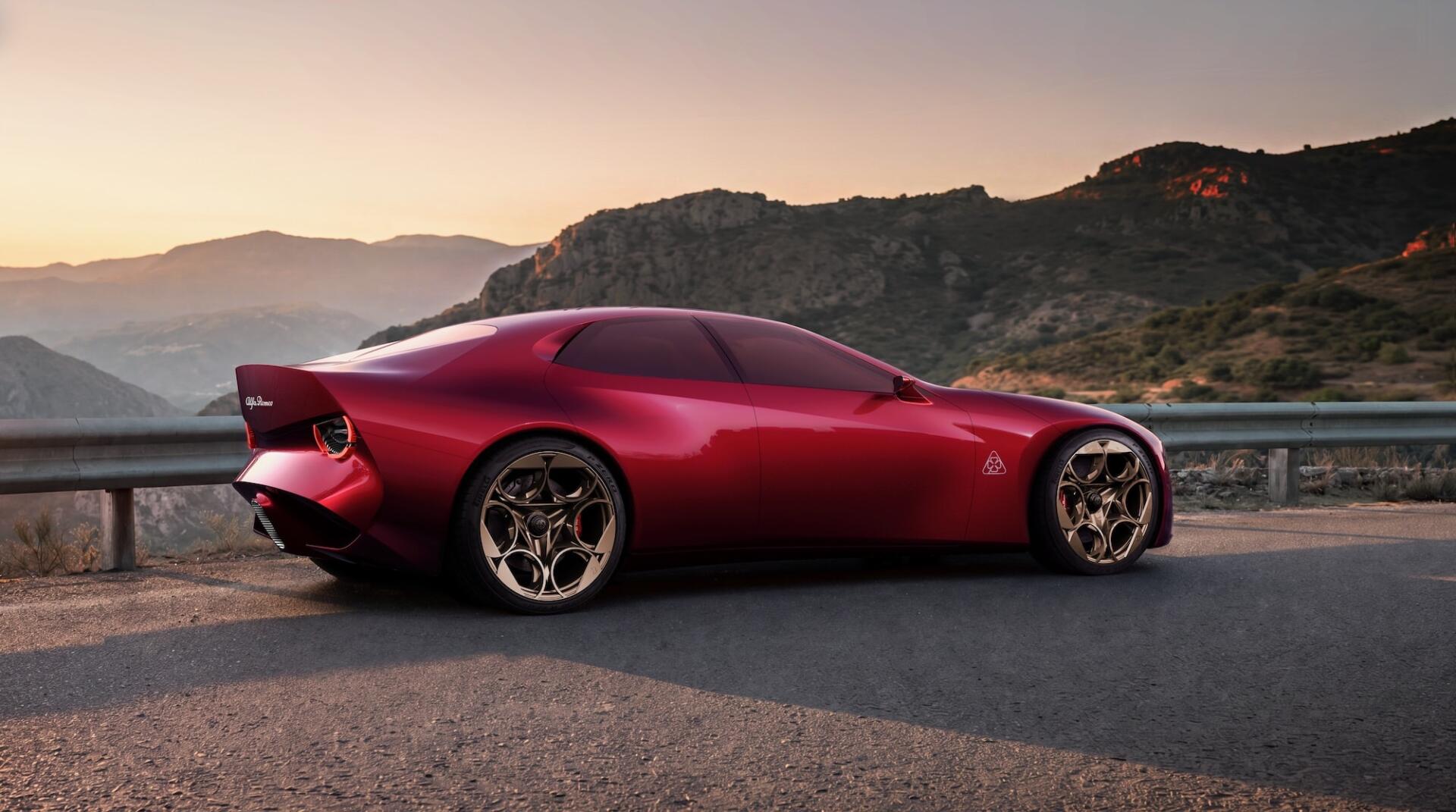 Red Alfa Romeo Cuorerosso concept sports car on a mountain road at sunset, HD desktop wallpaper and background.