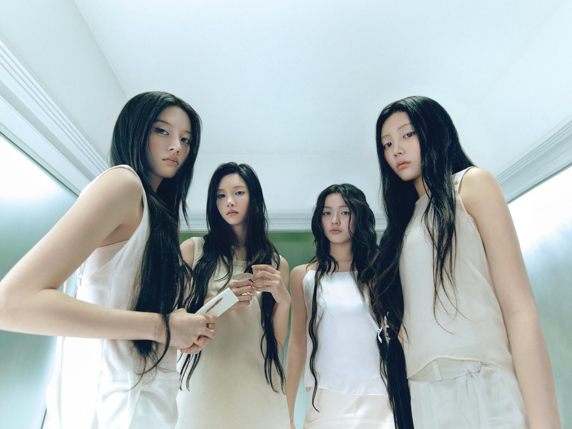 ILLIT Break Even group portrait of four women in white outfits, featured in a 4K Ultra HD PC desktop wallpaper and background.