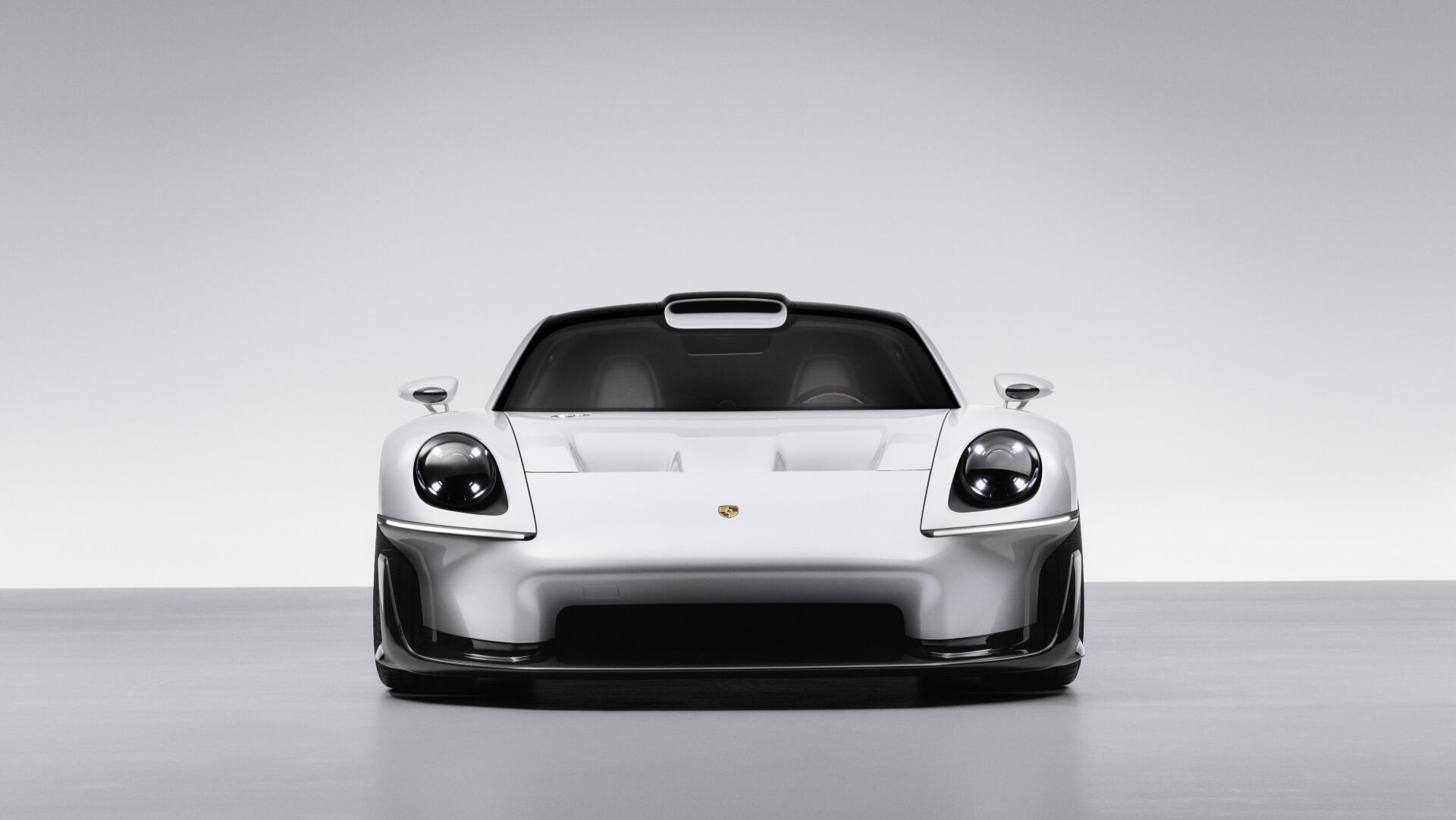 Front view of a white Porsche Mission S sports car, featured in a 5K Ultra HD PC desktop wallpaper and background.