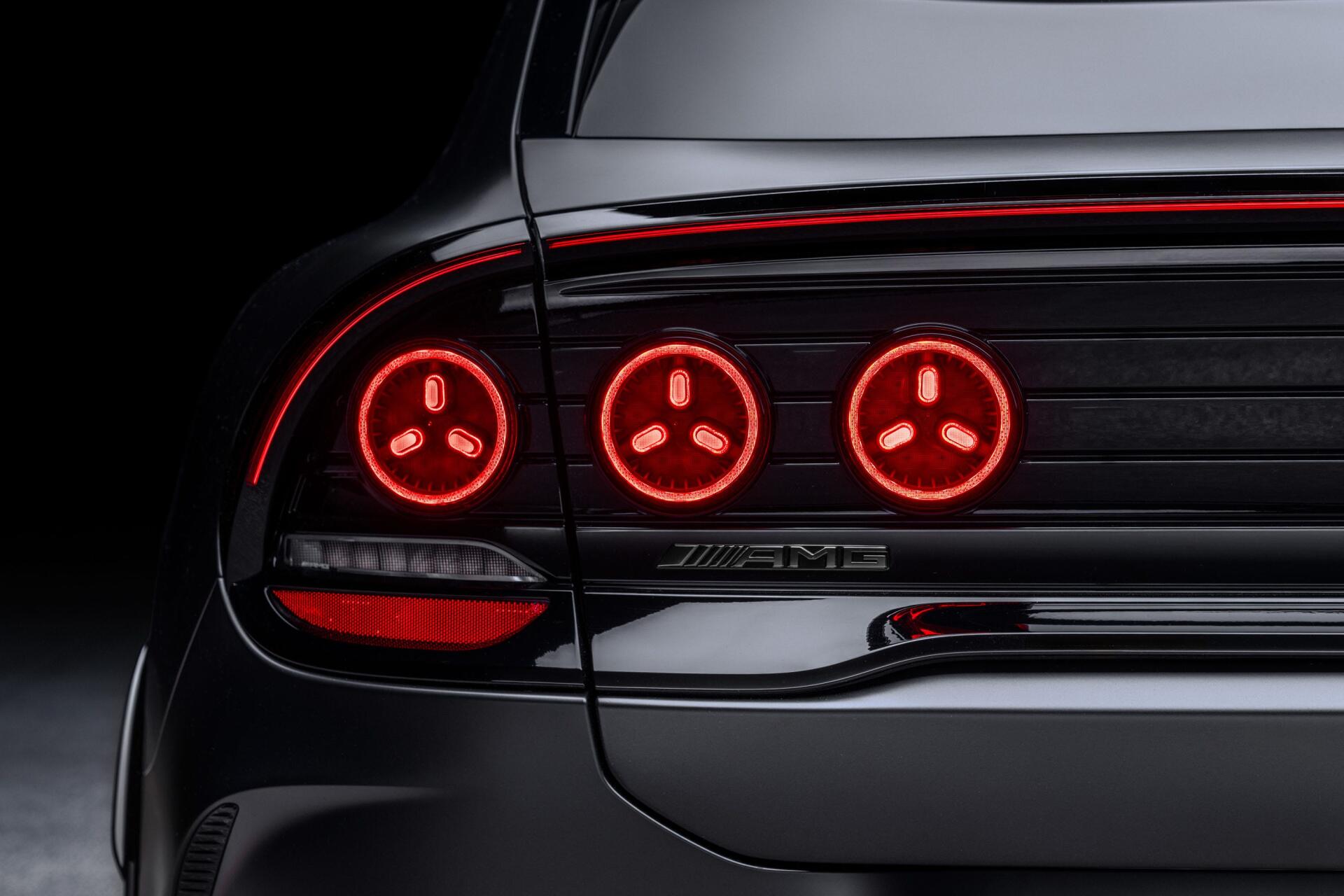 Close-up of the Mercedes-AMG GT SUV’s glowing red taillights, featured in a 2K Quad HD PC desktop wallpaper and background.