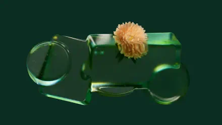 Microsoft Opaline 4K Ultra HD PC desktop wallpaper and background: translucent green glass toy car topped with a pale orange pompom flower against a deep green field.