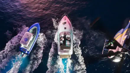 Aerial view of three speedboats cutting through neon-lit ocean at night — Grand Theft Auto VI video game, 4K Ultra HD PC desktop wallpaper/background.