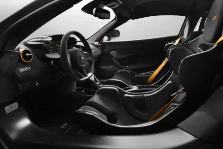 Interior view of a McLaren 788HS sports car with carbon-fiber racing seats, yellow harness accents and a minimalist cockpit — 8K Ultra HD PC desktop wallpaper.