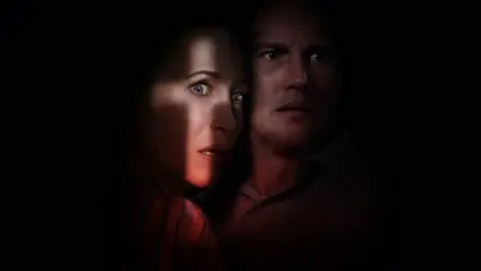 Dark 4K Ultra HD PC desktop wallpaper for The Conjuring: The Devil Made Me Do It showing two tense, shadowed faces lit by a narrow beam of light against a black background.