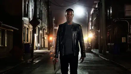 24: Legacy — 4K Ultra HD PC desktop wallpaper: a lone man in a leather jacket walks down a dim, rain-slick city alley at night, backlit by car headlights, holding a handgun.