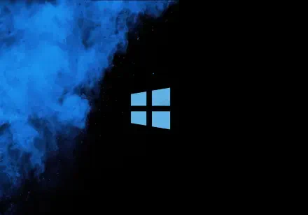 Windows 11 Microsoft 4K Ultra HD PC desktop wallpaper: glowing blue Windows logo centered on black background with swirling blue smoke
