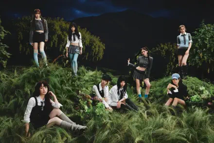 4K Ultra HD PC desktop wallpaper tagged NiziU and Sour Grapes: seven women in coordinated outfits posed among tall grass under a moody, moonlit sky.