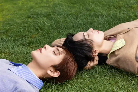 Jeonghan and Joshua Hong of Seventeen reclining on grass, 4K Ultra HD PC desktop wallpaper and background.