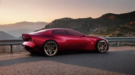 Red Alfa Romeo Cuorerosso concept sports car on a mountain road at sunset, HD desktop wallpaper and background.
