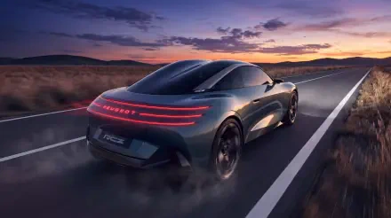 Peugeot RCZ Vision electric sports car concept driving on a highway at sunset, 5K Ultra HD desktop wallpaper background.