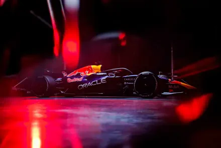 Red Bull Racing RB22 F1 race car under dramatic red lights, 4K Ultra HD PC desktop wallpaper and background.