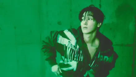 ATEEZ’s San in a moody green Golden Hour portrait, featured in a 5K Ultra HD PC desktop wallpaper and background.