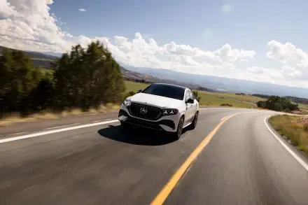 Mercedes-Benz GLE Coupe driving along a winding country road, HD desktop wallpaper and background.