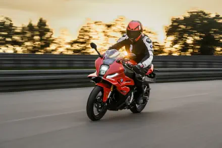 BMW Motorrad F 450 RR sport motorcycle ridden on a road at sunset, featured in a 5K Ultra HD desktop wallpaper.