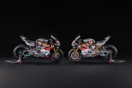 Ducati Panigale V4 R racing motorcycles facing each other against a dark background, 8K Ultra HD desktop wallpaper.