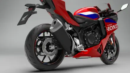 Red Honda CBR500R Four sport bike in a studio, featured in a 4K Ultra HD desktop wallpaper.