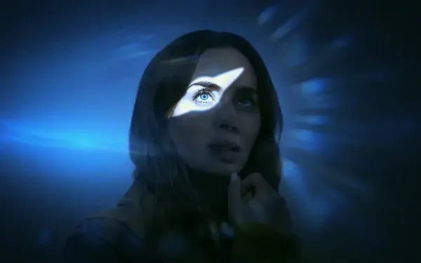 Disclosure Day 4K Ultra HD PC desktop wallpaper: woman lit in blue with a triangular, eye-shaped beam across her face, thoughtful against a dark, tech-like background.