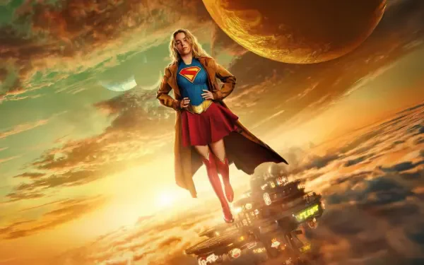 Supergirl (2026) soars above golden clouds toward a distant planet, cape billowing over a futuristic city — 5K Ultra HD PC desktop wallpaper and background.