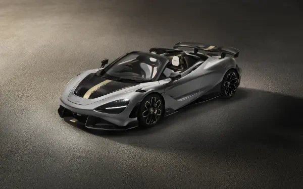 Silver McLaren 788HS convertible roadster on textured asphalt, presented as an 8K Ultra HD PC desktop wallpaper and background.