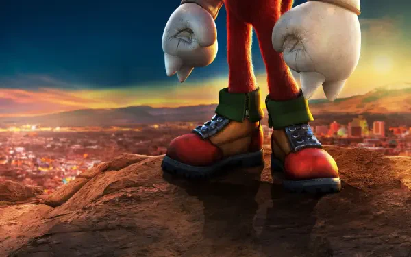 Knuckles (2024) 2K Quad HD PC desktop wallpaper: close-up of Knuckles' boots and fists on a cliff overlooking a sunlit cityscape.