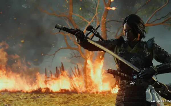 HD PC desktop wallpaper: Ghost of Yōtei samurai warrior drawing a katana amid a burning battlefield and twisted tree, cinematic video game background.