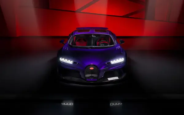 Front view of a purple Bugatti Chiron Super Sport car on a glossy floor with red geometric backdrop — 4K Ultra HD PC desktop wallpaper and background.