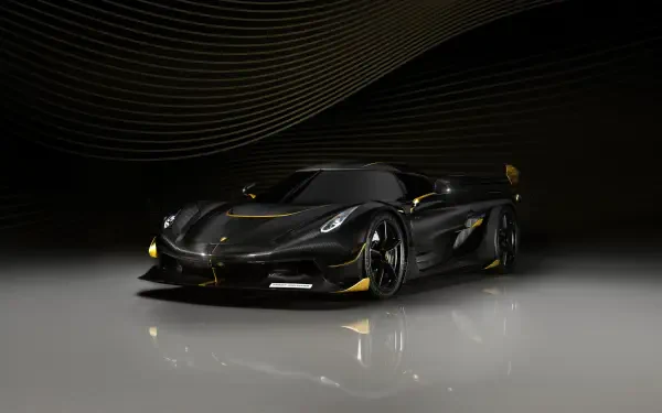 Koenigsegg Jesko hypercar in glossy black with gold accents, dramatic studio lighting on a reflective floor — 4K Ultra HD PC desktop wallpaper/background.