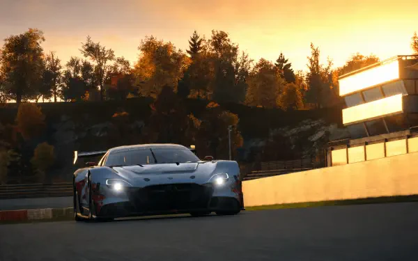 Gran Turismo 7 sports race car speeding on a sunset track, 4K Ultra HD PC desktop wallpaper and background.