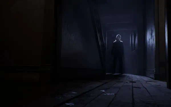 HD PC desktop wallpaper depicting Michael Myers (Halloween: The Game) silhouette standing at the end of a dark, decaying hallway.