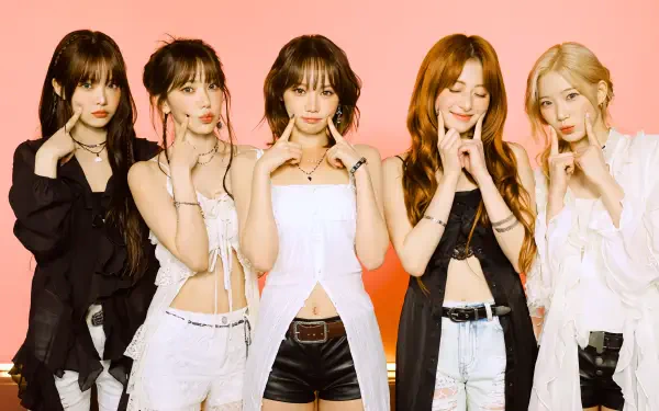 Five female K-pop performers in coordinated black-and-white outfits posing against a peach backdrop — 5K Ultra HD PC desktop wallpaper.