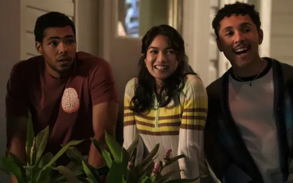 4K Ultra HD PC desktop wallpaper: three smiling people leaning over an interior railing in a warm, candid still from The Love Hypothesis.