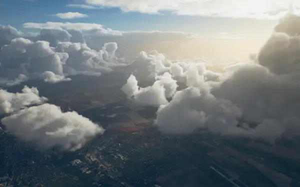 Ace Combat 8: Wings of Theve HD PC wallpaper — aerial view of sunlit clouds and wide sky above a detailed patchwork landscape, designed as a desktop background.