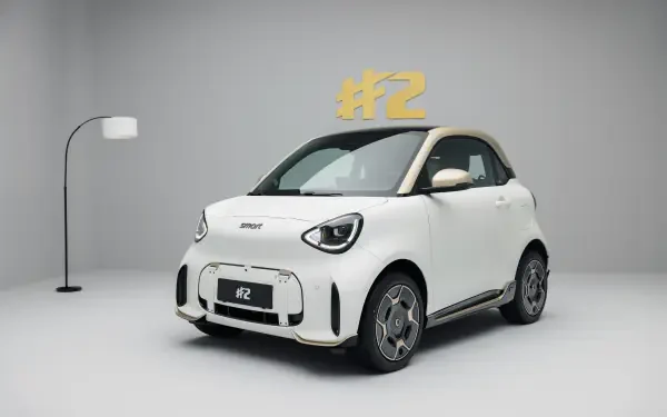 White smart #2 electric compact car in a minimalist studio, featured in an 8K Ultra HD desktop wallpaper.